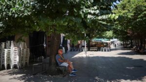 People seek shade during an extreme heatwave as the WHO warns of rising temperatures across Europe.