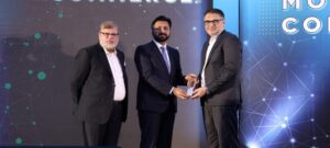 ABHI Microfinance Bank representatives receiving the Phoenix Award at Mobile Commerce 2026 in Karachi.