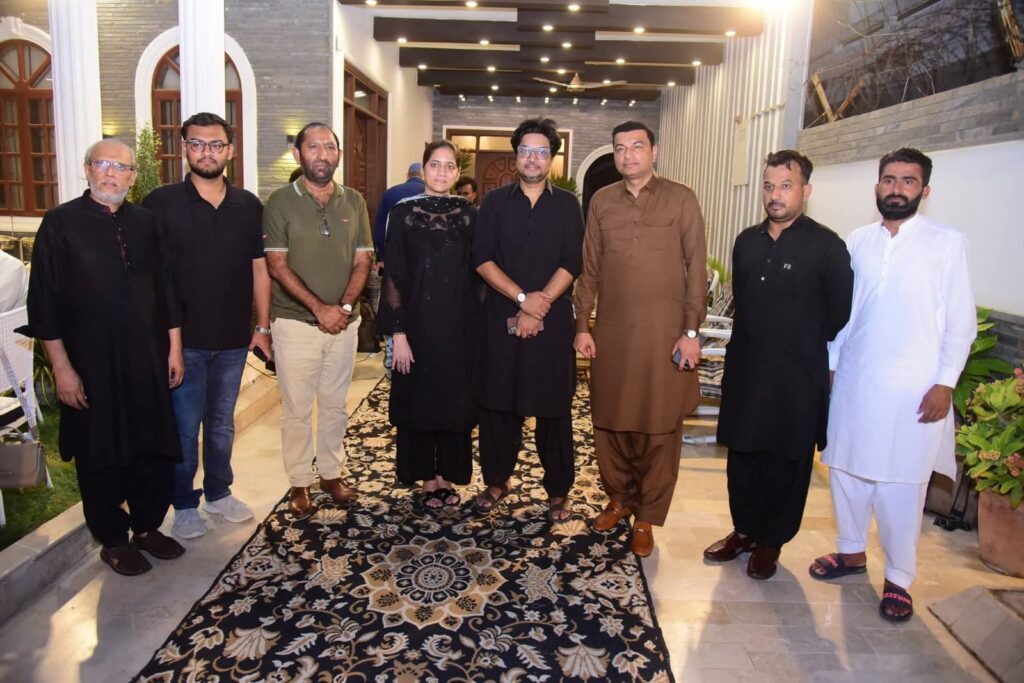 Political leaders, officials and guests at the Dastar Khuwan-e-Moula Hussain event in Karachi.