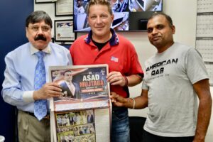 Assad Mujtaba stands with political and community leaders after receiving endorsements during America’s 250th birthday celebration near Clifton City Hall.