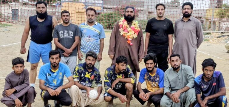 Players of Bhatti Sports Karachi receive the winning trophy after defeating Arifwala Hub in a Shooting Ball exhibition match held at Hub Chowki, Balochistan.