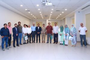 Prof. Dr. Jamshed Ahmed addresses journalists during a mental health and psychological resilience workshop at Ziauddin University in Karachi.