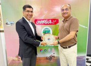 Zahid Hameed receives an appreciation shield from Brigadier Yaqoob Awan in recognition of organising the Marka-e-Haq community event.