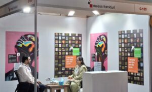 Messe Frankfurt team engaging with exhibitors and visitors at the Textile Asia 2026 exhibition at Expo Centre Lahore.