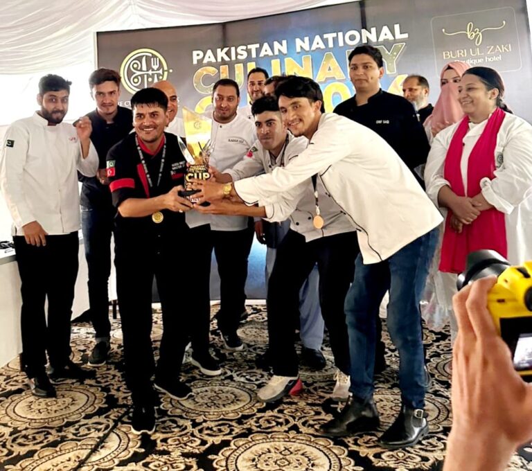 Team Chushi Wok receives the championship trophy at the Pakistan National Culinary Cup 2026 in Islamabad.
