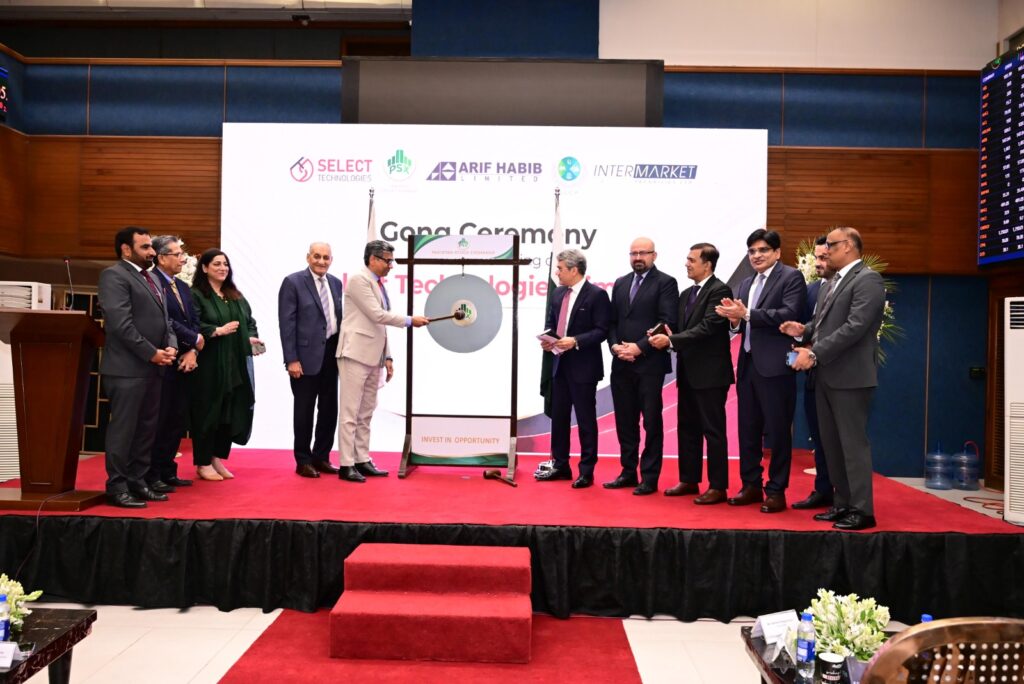 Executives of Select Technologies, Pakistan Stock Exchange and stakeholders participate in the gong ceremony marking the company's successful IPO listing in Karachi.