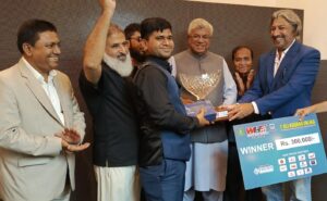 Champion Rana Irfan celebrates with the trophy after defeating Mubashir Raza in the inaugural Ali Asghar Valika All-Pakistan Snooker Championship in Karachi.