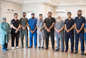 Medical team at Al-Shifa Trust Eye Hospital treating a newborn after removing a rare congenital eye tumor in Pakistan.