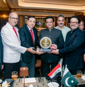 Kafeel Hussain presents a commemorative shield to Iraq’s Consul General at a diplomatic farewell reception hosted by KHA Business & International Relations.
