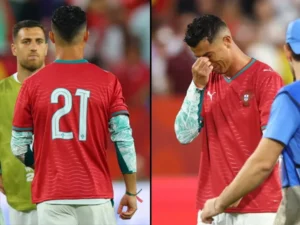 Cristiano Ronaldo wearing Diogo Jota's No. 21 Portugal jersey during an emotional post-match tribute.