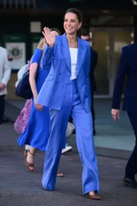 Kate Middleton, Princess of Wales, wearing a blue suit during her visit to Wimbledon at the All England Lawn Tennis and Croquet Club.