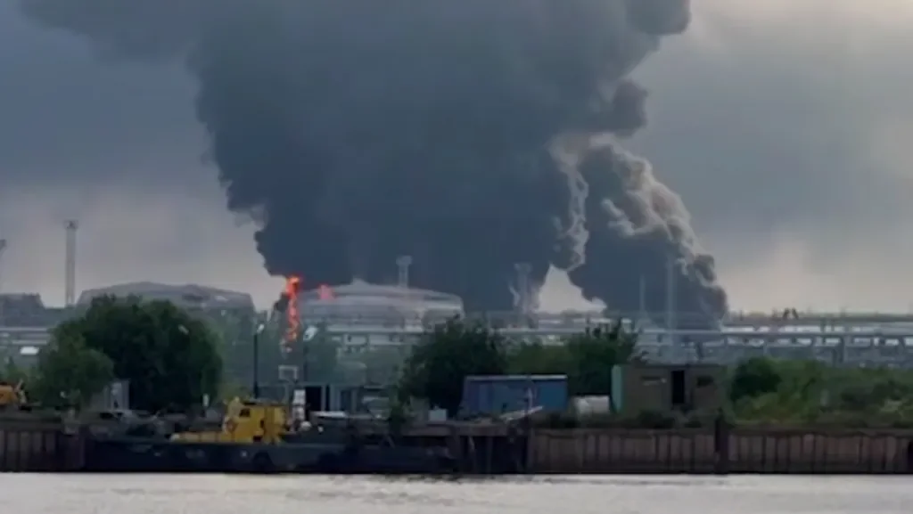Black smoke billows above a major oil terminal in St Petersburg following a reported Ukrainian drone attack.