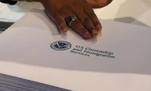 USCIS office sign representing the updated uscis application denial policy