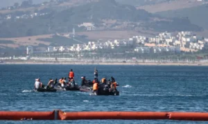 Spanish police and soldiers secure the Ceuta border after thousands of migrants crossed from Morocco.