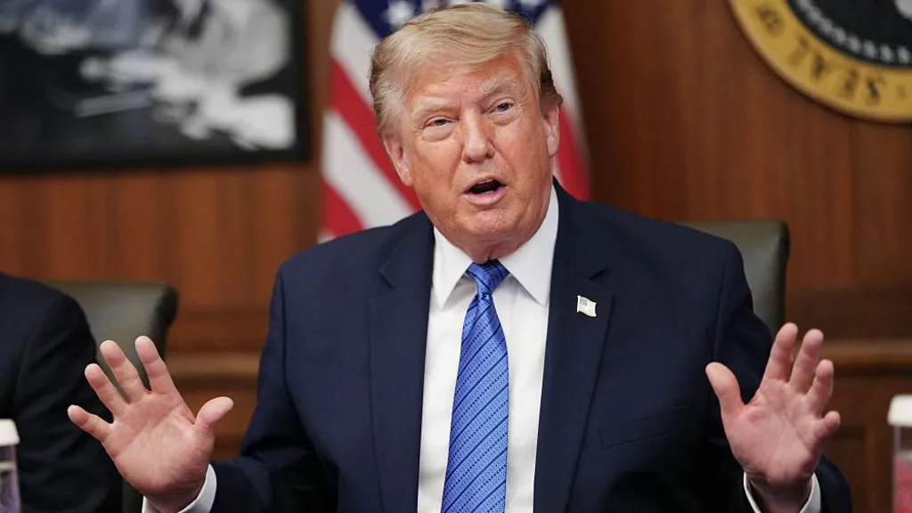 US President Donald Trump addressing reporters amid growing political challenges and Iran war tensions.
