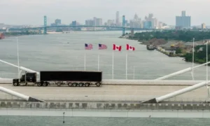 US and Canadian flags representing rising trade tensions and new tariffs