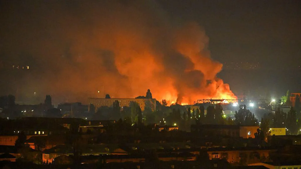 Rescue workers search damaged buildings following Russia's missile and drone attack on Kyiv.