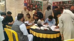 Men and women cast their votes during the second phase of AJK Elections at a polling station in Balochistan.
