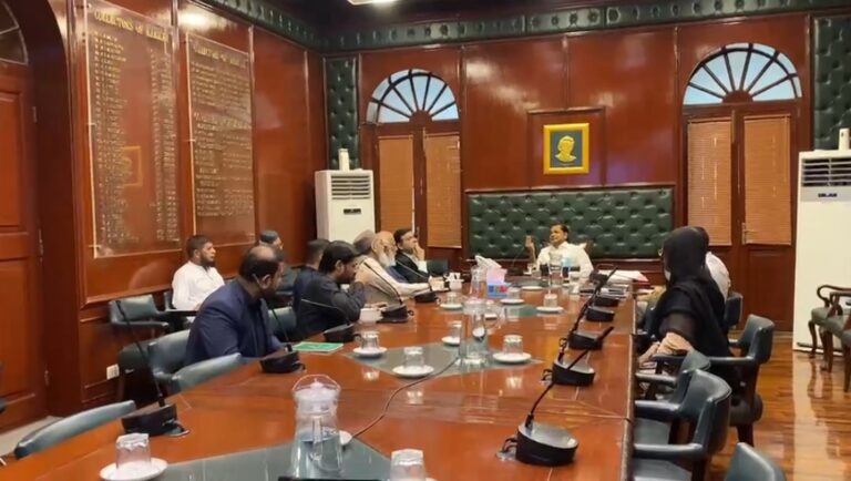 Karachi Commissioner Syed Hassan Naqvi chairs a meeting with flour mill owners on reducing flour prices in the city.