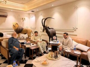 Ishtiaq Baig and Sindh Local Government Minister Syed Nasir Hussain Shah discussing community development projects.