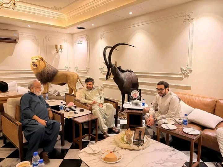 Ishtiaq Baig and Sindh Local Government Minister Syed Nasir Hussain Shah discussing community development projects.