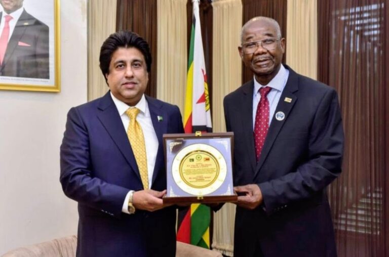 Imran Khan Tessori with Zimbabwe Ambassador Titus M.J. Abu-Basutu during bilateral trade talks.