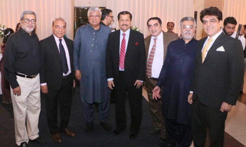 Shariq Vohra welcomes guests during his daughter's wedding reception at DHA Golf Club in Karachi.