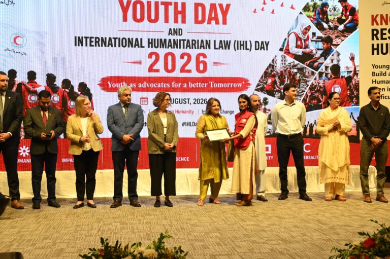 PRCS youth volunteers and officials attend a humanitarian ceremony in Islamabad.