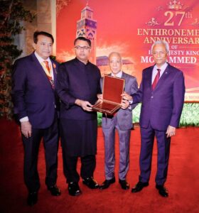 Azfar Ahsan receives a commemorative shield recognising his contribution to Morocco-Pakistan relations.