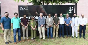 PTCL and WWF Pakistan officials planting trees during the Plant for Pakistan campaign in Islamabad.