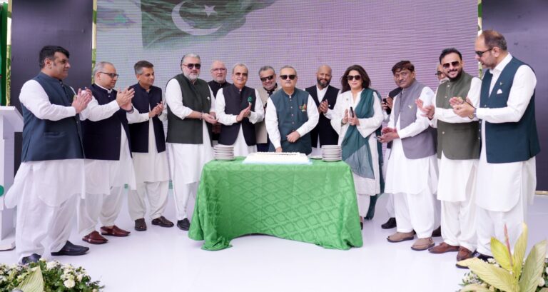 NBP President Rehmat Ali Hasnie and staff attend Pakistan Independence Day ceremony in Karachi.