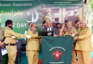 Sindh Governor Nihal Hashmi and scouts plant trees at Gulistan Scouts Training Centre in Karachi.