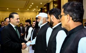 Field Marshal Asim Munir with Pakistan Army veterans at an Independence Day reception in Rawalpindi.