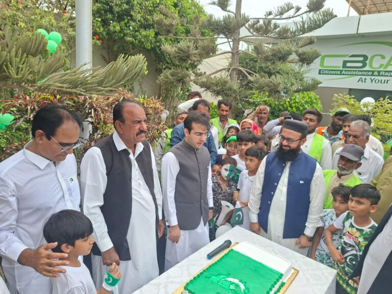 Korangi Creek Cantonment Board officials plant a tree during Pakistan Independence Day ceremony