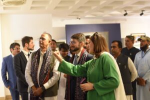 Consul General of Türkiye viewing artworks at Ishq-e-Zameen Art Exhibition in Karachi