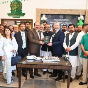 Rana Mashhood Ahmad Khan presents a Pakistani-made football to Spain Ambassador Carlos Aragón.