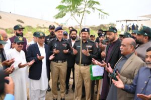 Officials launch a tree plantation project on Shahrah-e-Bhutto in Karachi to honour Sindh Police martyrs.