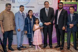 Eight-year-old author Izyana Umair launching The Art of Giving at a Karachi ceremony