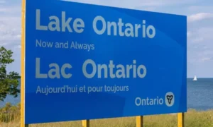 Apple Maps displays Lake America for US users while Canada continues to use the Lake Ontario name.