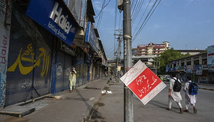 Karachi traders and lawyers participate in a Jamaat-e-Islami strike against petrol levy and electricity costs.