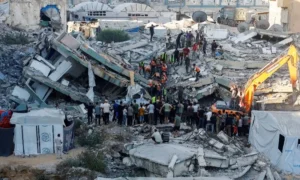 Gaza Civil Defence rescuers search rubble after a damaged apartment building collapsed in Gaza City.