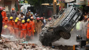 Rescue teams searching rubble after a building collapse in Delhi