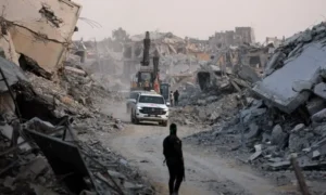 Damaged building shelters displaced Palestinian families in Gaza City.