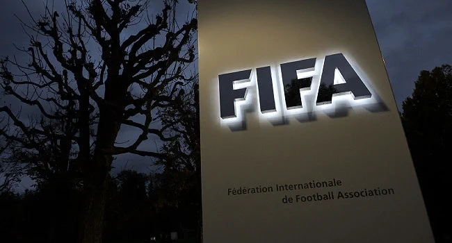 FIFA president Gianni Infantino and UEFA officials amid World Cup investor dispute.
