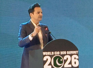 Ali Rashid addresses technology leaders at the World CIO 200 Summit in Karachi.