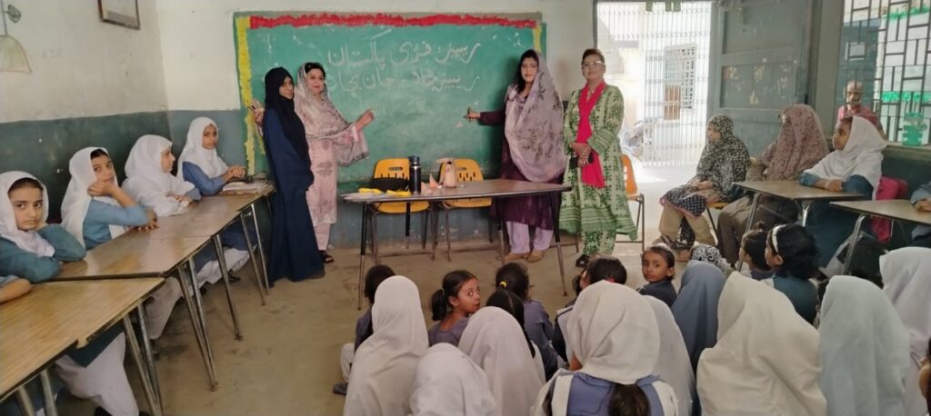 Students participate in a rabies prevention and dog-bite awareness session at a Karachi school.