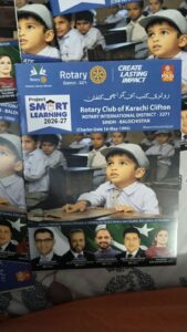 Rotary Club of Karachi Clifton activity book featuring numbers, alphabets, tracing and colouring activities.