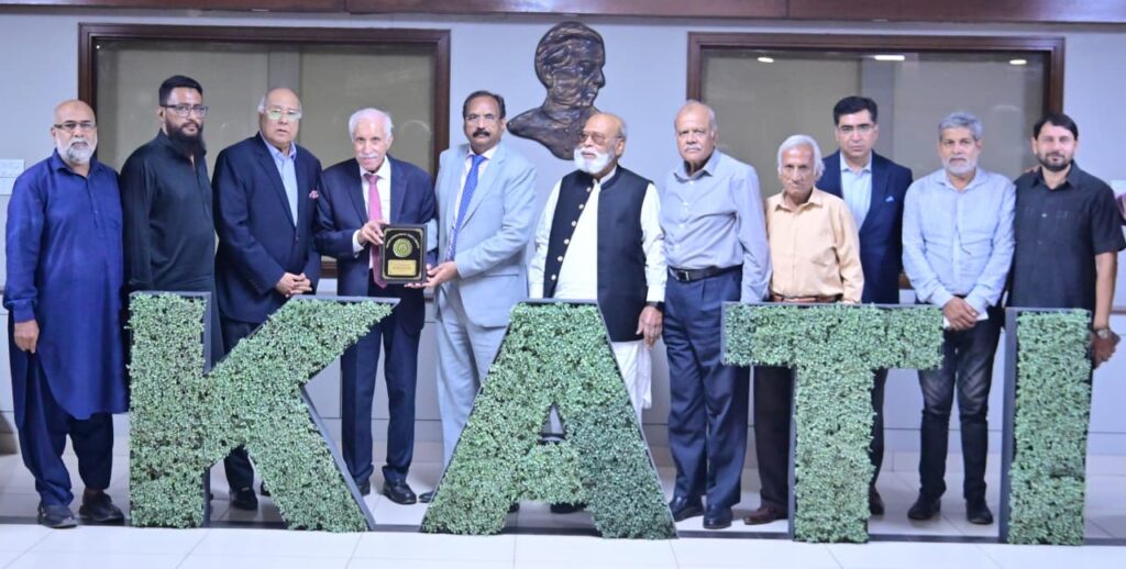 KATI President Muhammad Ikram Rajput presents a shield to BOI Minister Qaiser Ahmed Sheikh in Karachi.