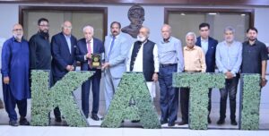 KATI President Muhammad Ikram Rajput presents a shield to BOI Minister Qaiser Ahmed Sheikh in Karachi.