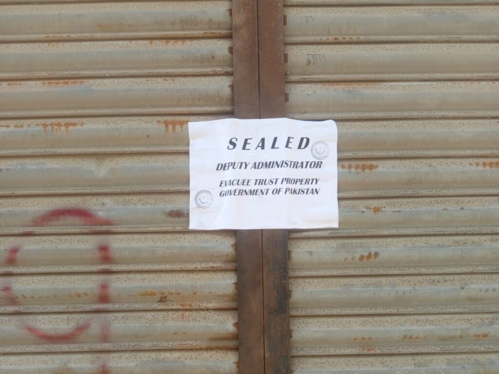 Evacuee trust properties in Karachi amid a dispute between federal and Sindh authorities.